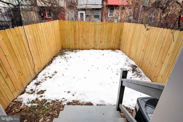a view of balcony with wooden floor