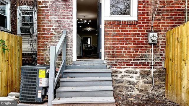 a view of a brick building with many windows