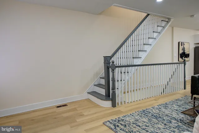 a view of entryway with wooden floor