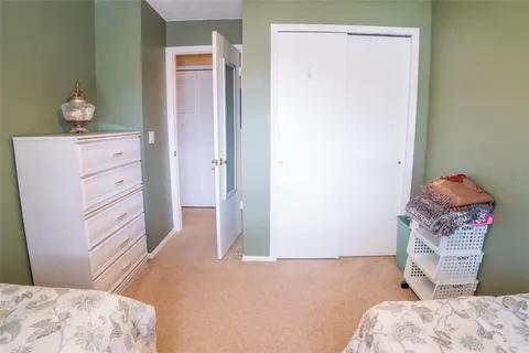 a bedroom with a bed and hallway