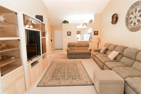 a living room with furniture and a rug