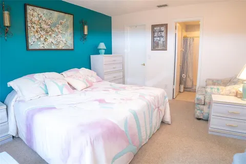 a bedroom with bed and window