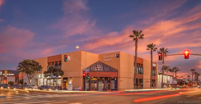 a front view of a building with a yard