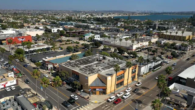 an aerial view of a building with an outdoor space