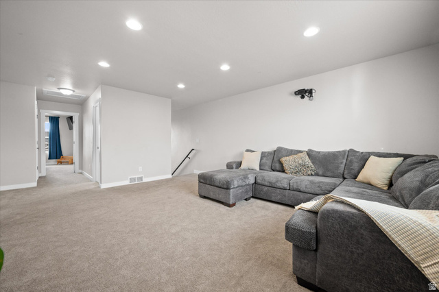 3359 Eurasian Crane Road Clinton, UT 84015 - Photo 28 of 71 Living room with light colored carpet and recessed lighting