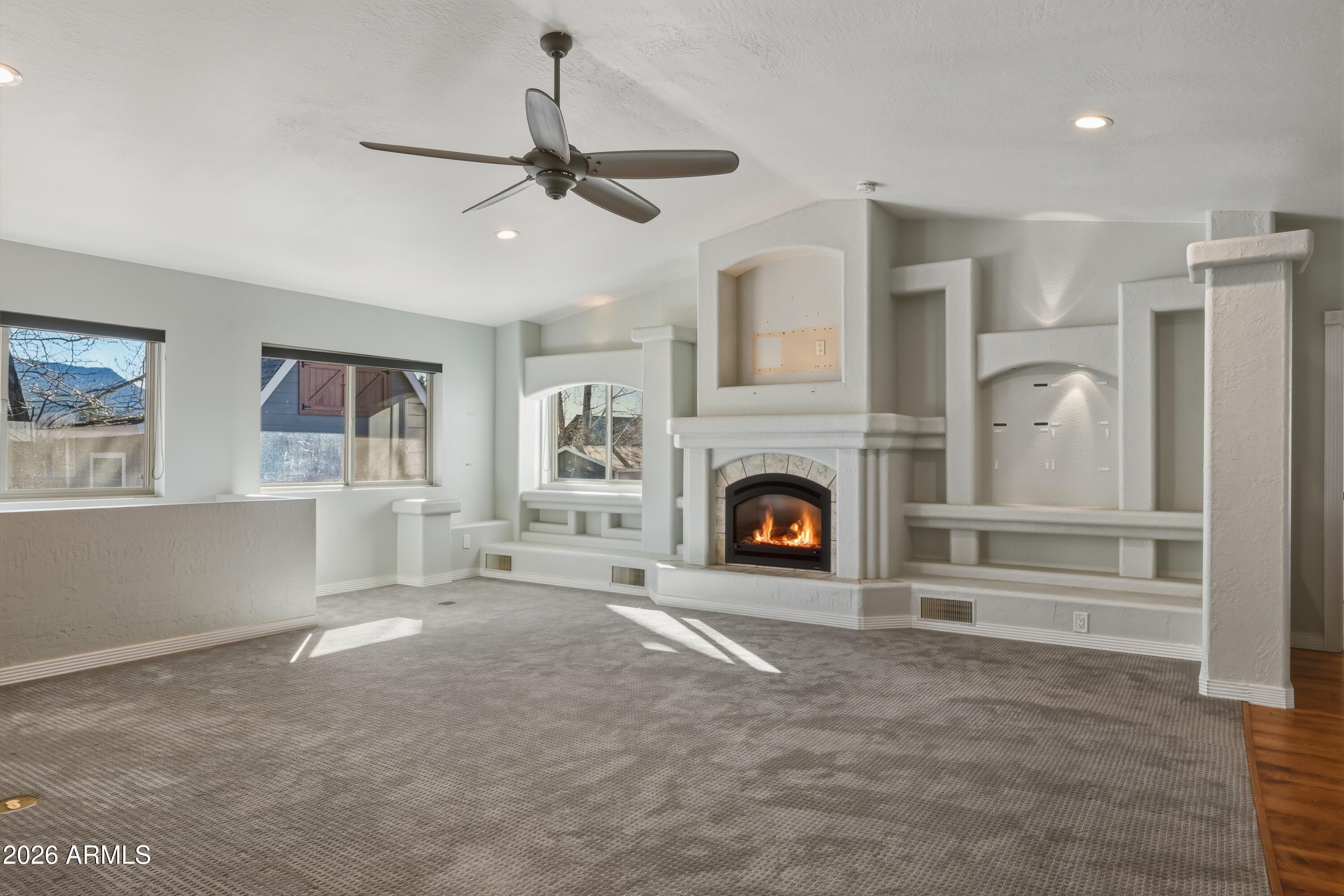 6475 Pine Cone Trail Pine, AZ 85544 - Photo 13 of 51 a living room with furniture and a fireplace