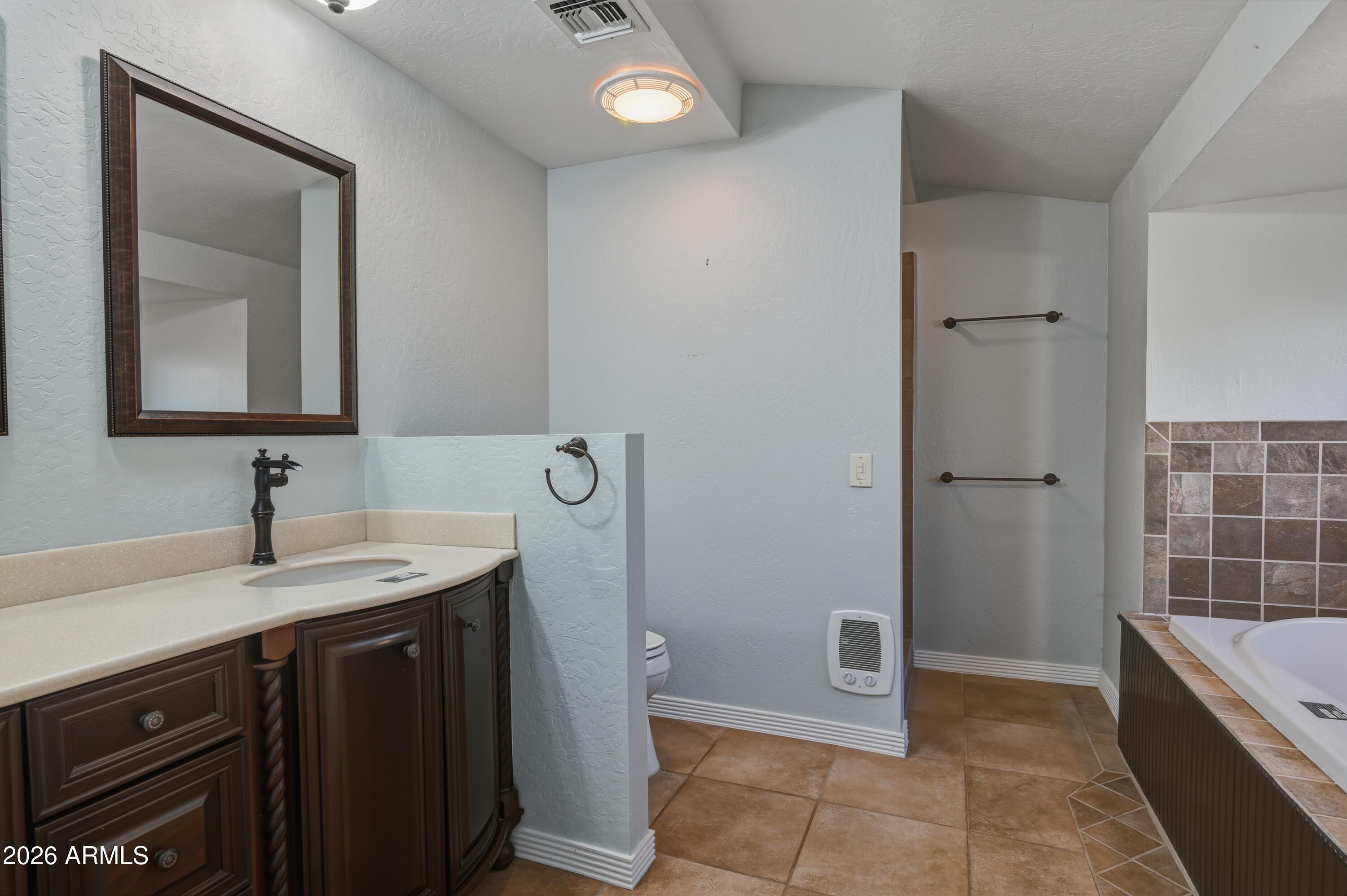 6475 Pine Cone Trail Pine, AZ 85544 - Photo 19 of 51 a bathroom with a granite countertop sink a toilet and mirror