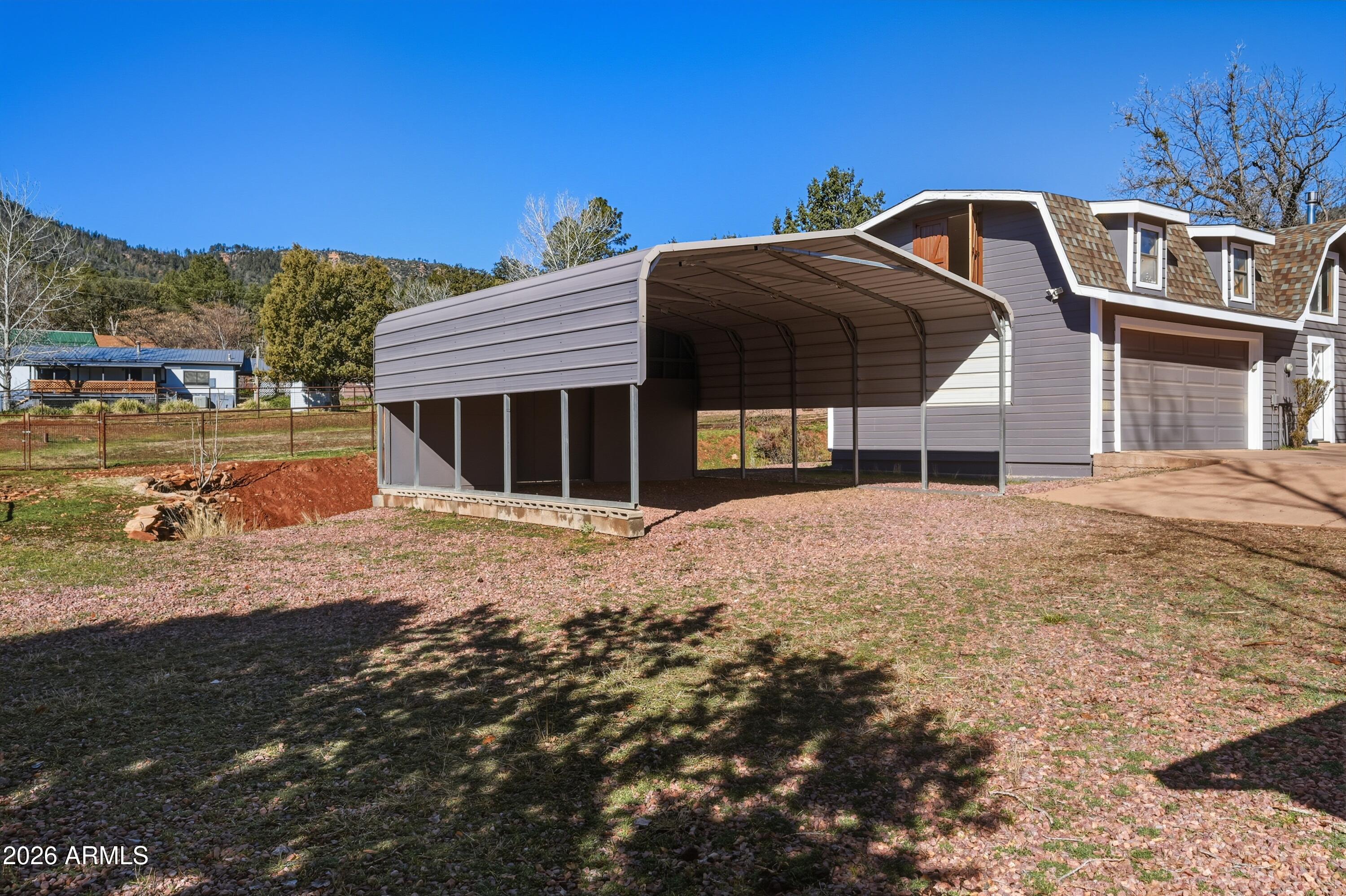 6475 Pine Cone Trail Pine, AZ 85544 - Photo 34 of 51 a front view of a house with a yard