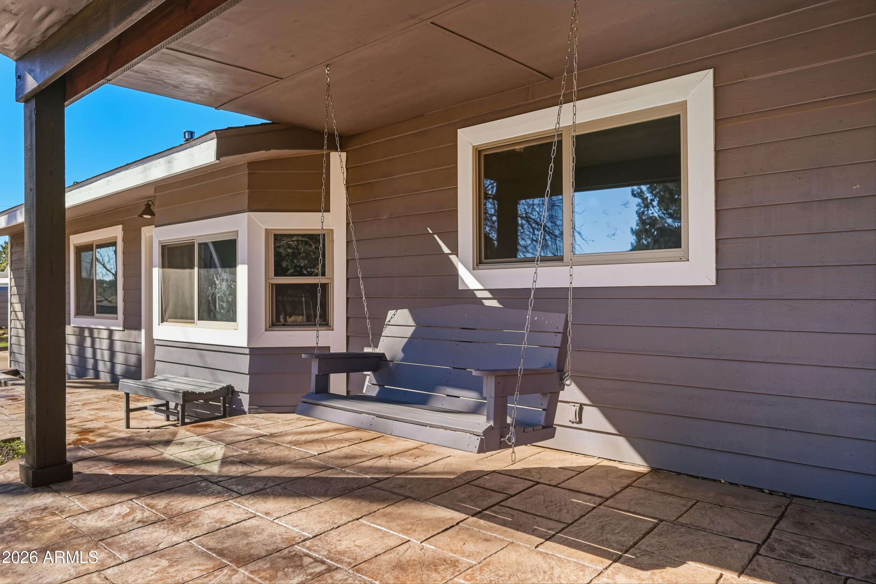 6475 Pine Cone Trail Pine, AZ 85544 - Photo 5 of 51 a bench is sitting in front of a house