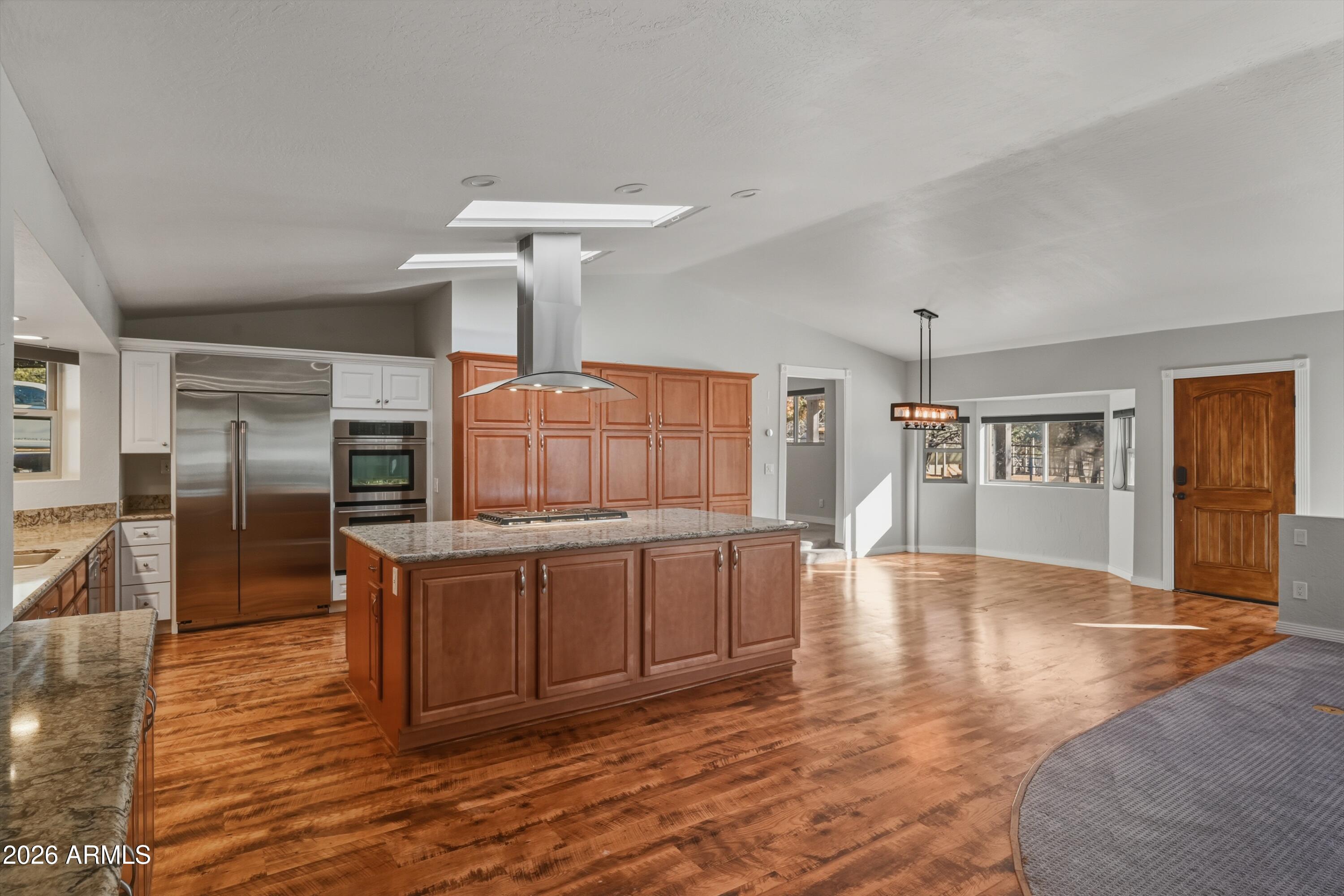 6475 Pine Cone Trail Pine, AZ 85544 - Photo 8 of 51 a kitchen with stainless steel appliances granite countertop a sink and cabinets