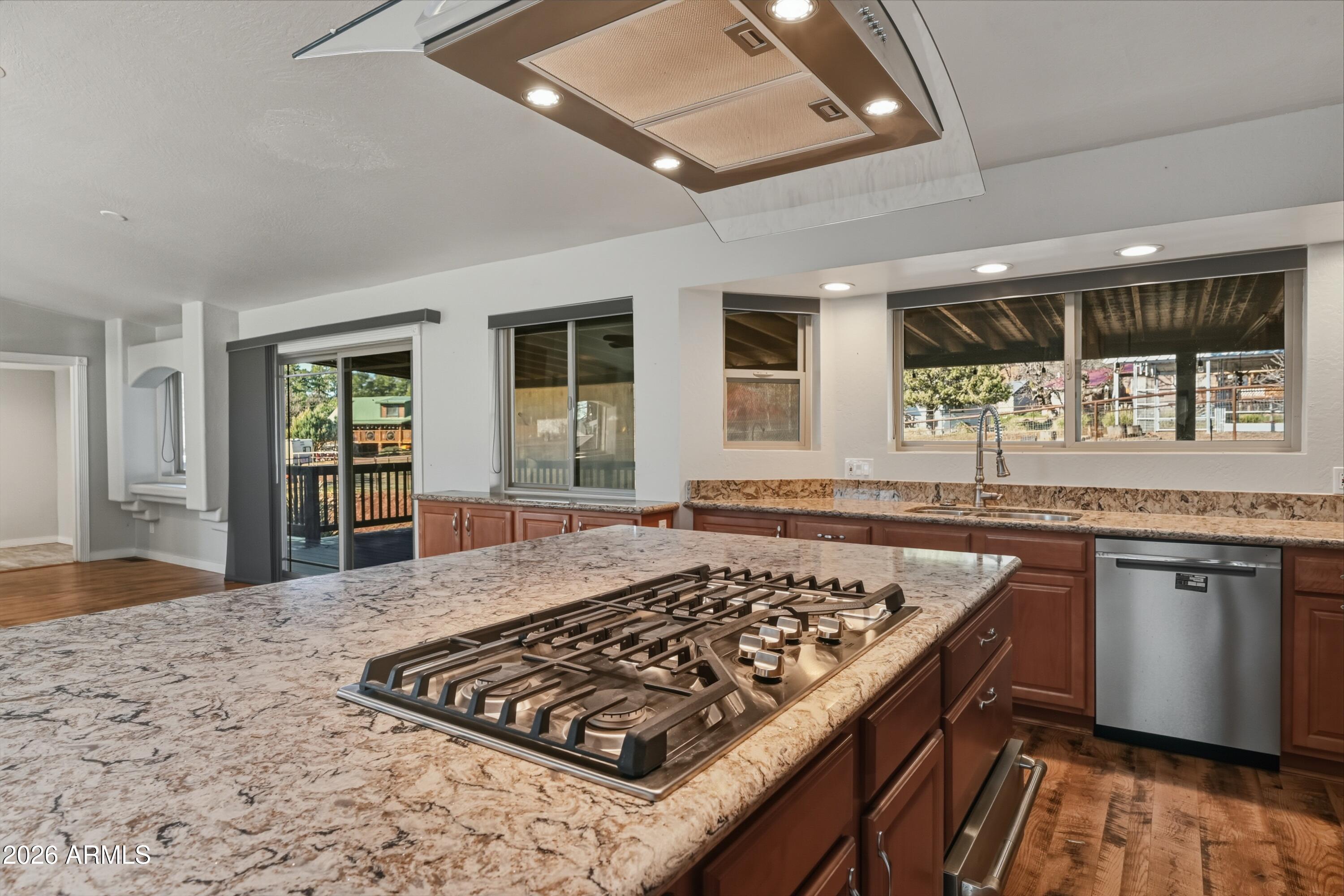 6475 Pine Cone Trail Pine, AZ 85544 - Photo 10 of 51 a kitchen with stainless steel appliances granite countertop a stove and a sink