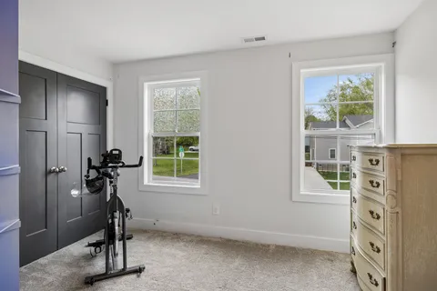 a view of a livingroom with furniture and a window