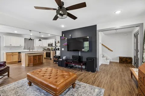 a living room with furniture and a flat screen tv