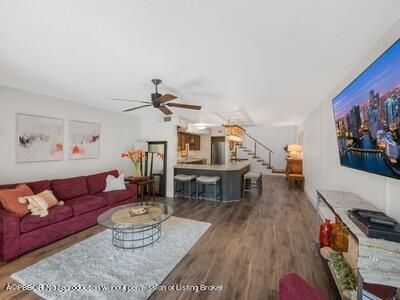 382 Golfview Road, Unit H North Palm Beach, FL 33408 - Photo 11 of 22 a living room with furniture and wooden floor