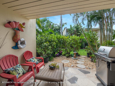 382 Golfview Road, Unit H North Palm Beach, FL 33408 - Photo 12 of 22 a view of yard with furniture