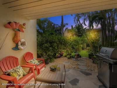 382 Golfview Road, Unit H North Palm Beach, FL 33408 - Photo 13 of 22 a backyard of a house with outdoor seating