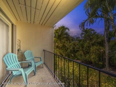 382 Golfview Road, Unit H North Palm Beach, FL 33408 - Photo 21 of 22 a view of balcony with two chairs and a potted plant