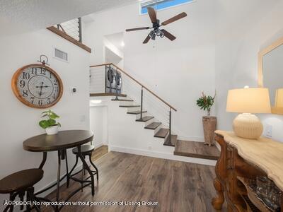 382 Golfview Road, Unit H North Palm Beach, FL 33408 - Photo 6 of 22 a view of entryway with wooden floor