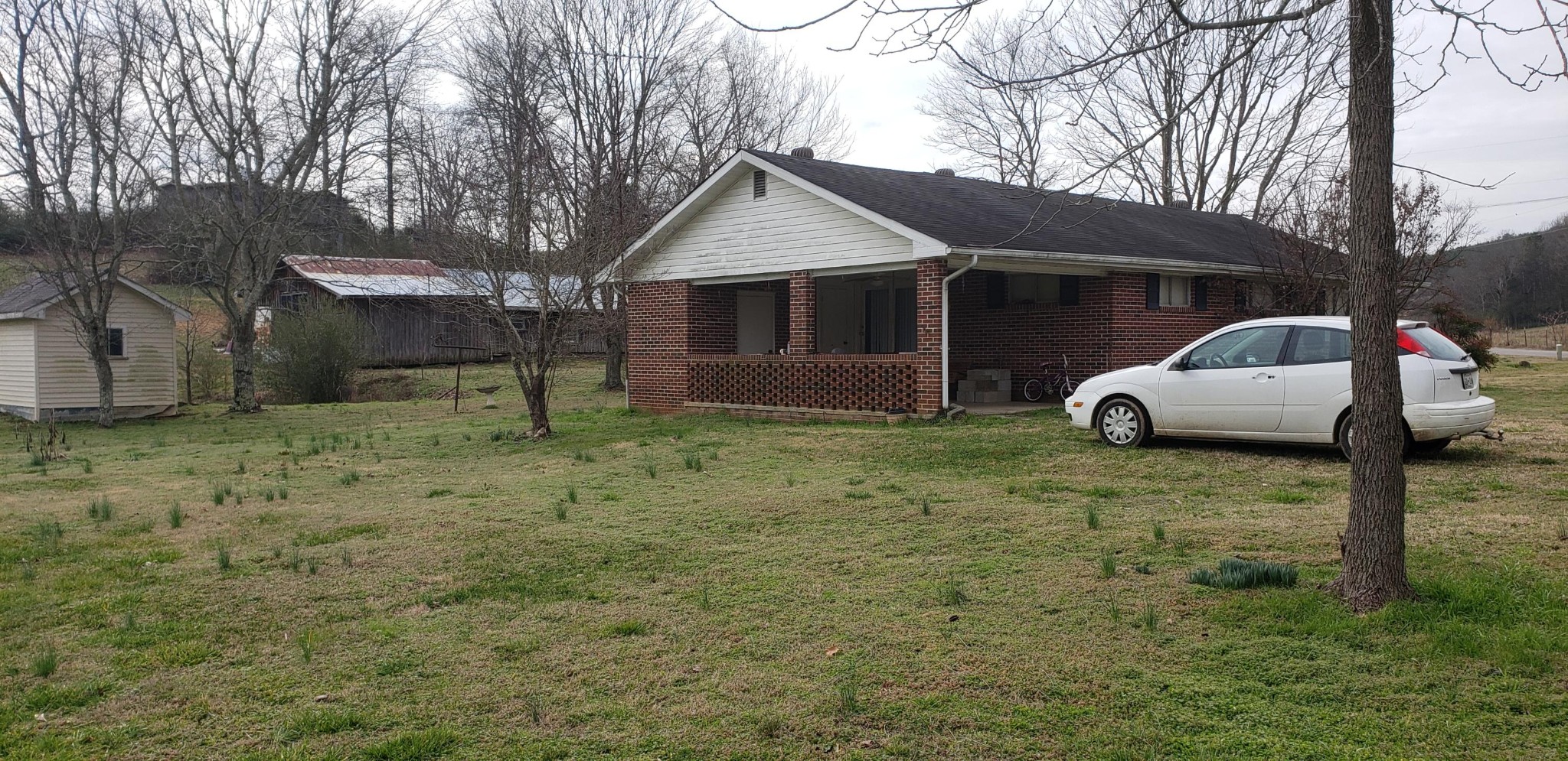 7600 Little Valley Road Loudon, TN 37774 - Photo 3 of 7 a front view of a house with a yard and garage