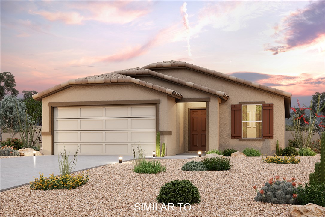 2575 Montano Ridge Drive Bullhead City, AZ 86442 - Photo 1 of 2 a backyard of a house with potted plants