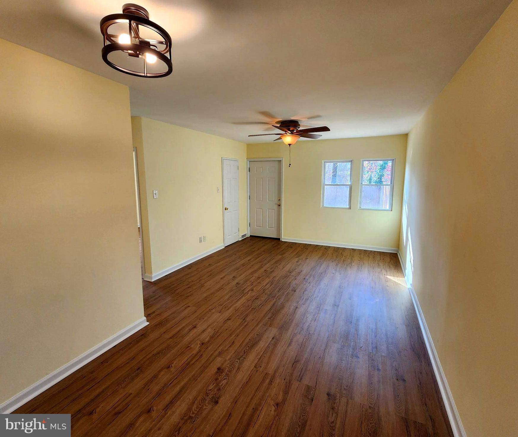 7533 Greenleaf Road Landover, MD 20785 - Photo 14 of 36 a view of an empty room with wooden floor and a window