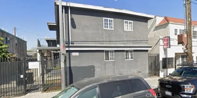 a front view of a house with parking