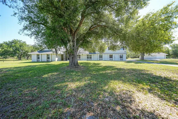 a house view with a garden space