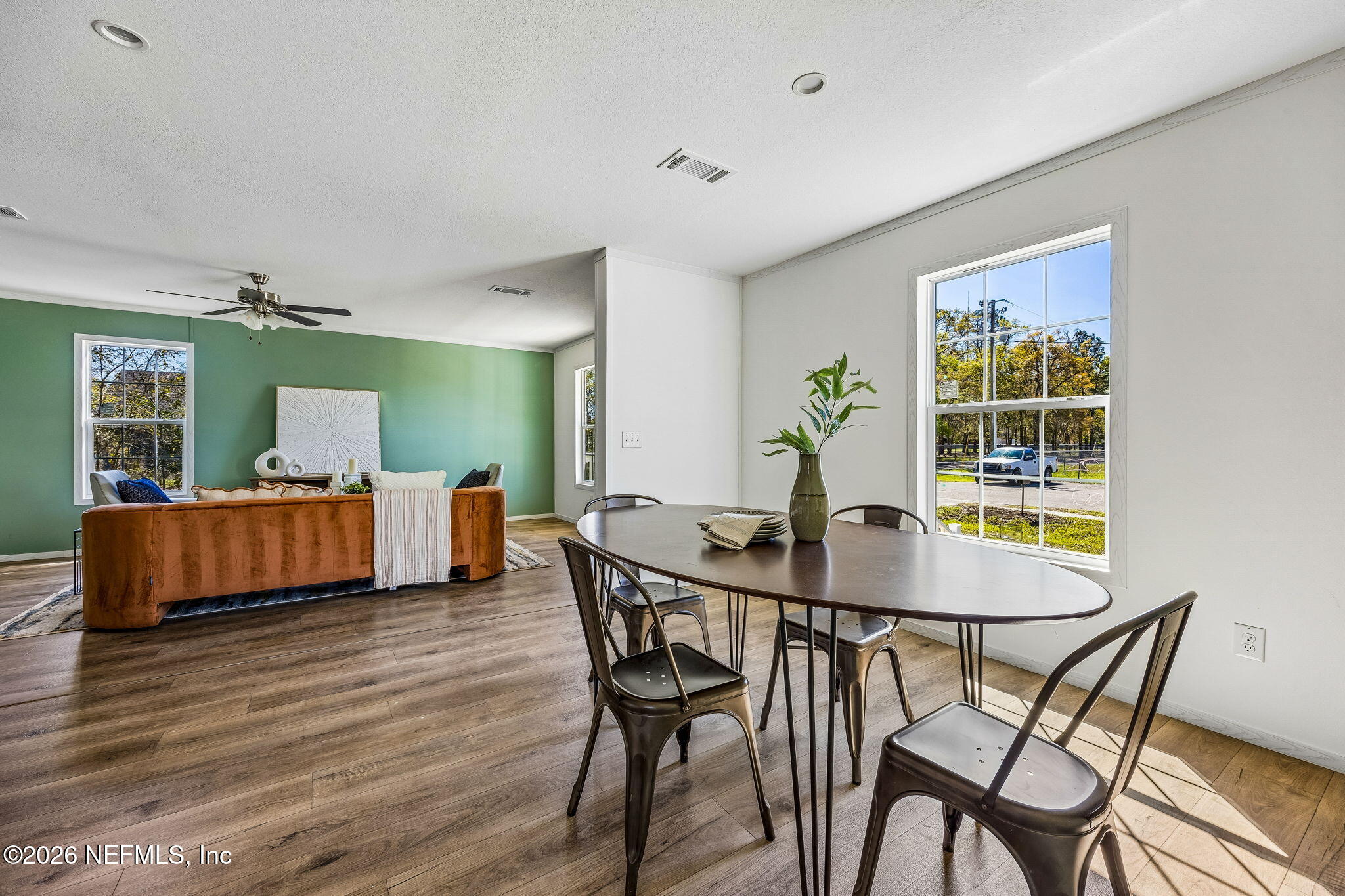 27450 West 3rd Avenue Hilliard, FL 32046 - Photo 5 of 24 a view of a dining room with furniture and wooden floor