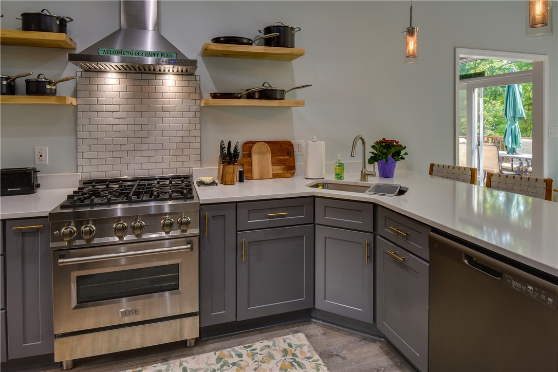 206 Petty Road Seneca, SC 29672 - Photo 10 of 48 Culinary delights await in this modern kitchen with sleek stainless steel appliances and ample counter space.