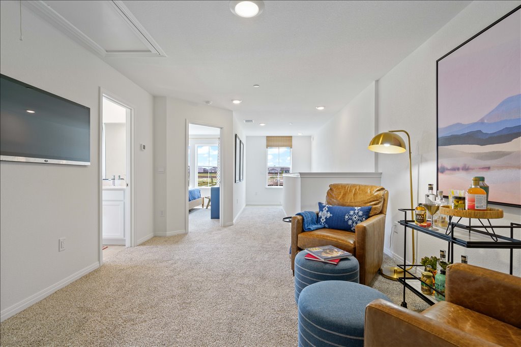 2534 Caleb Asher Loop Round Rock, TX 78665 - Photo 22 of 40 a living room with furniture and a chandelier