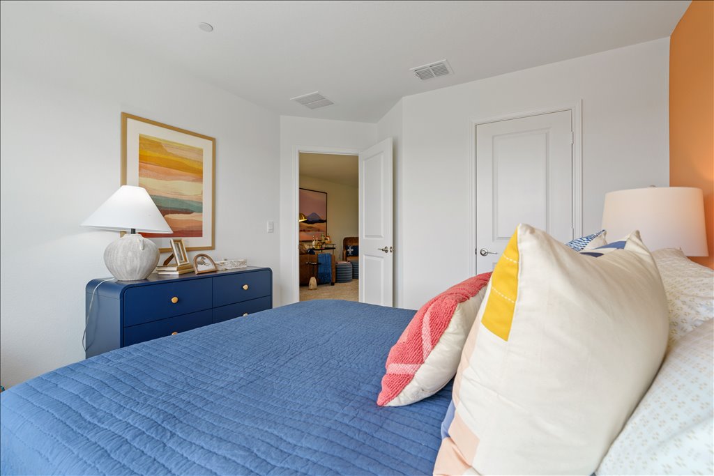 2534 Caleb Asher Loop Round Rock, TX 78665 - Photo 24 of 40 a bedroom with a bed and a dresser