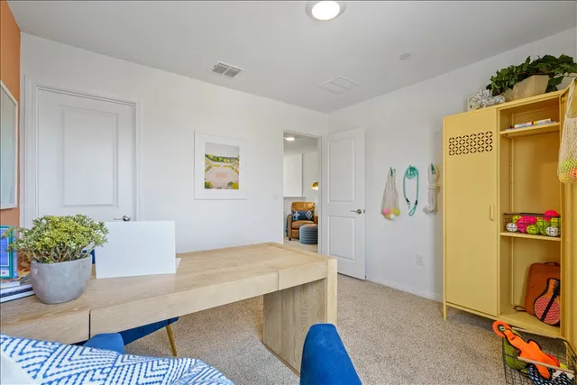 a room with furniture and painting on the wall