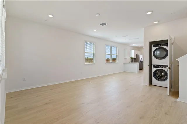 a living room with a couch and potted plant