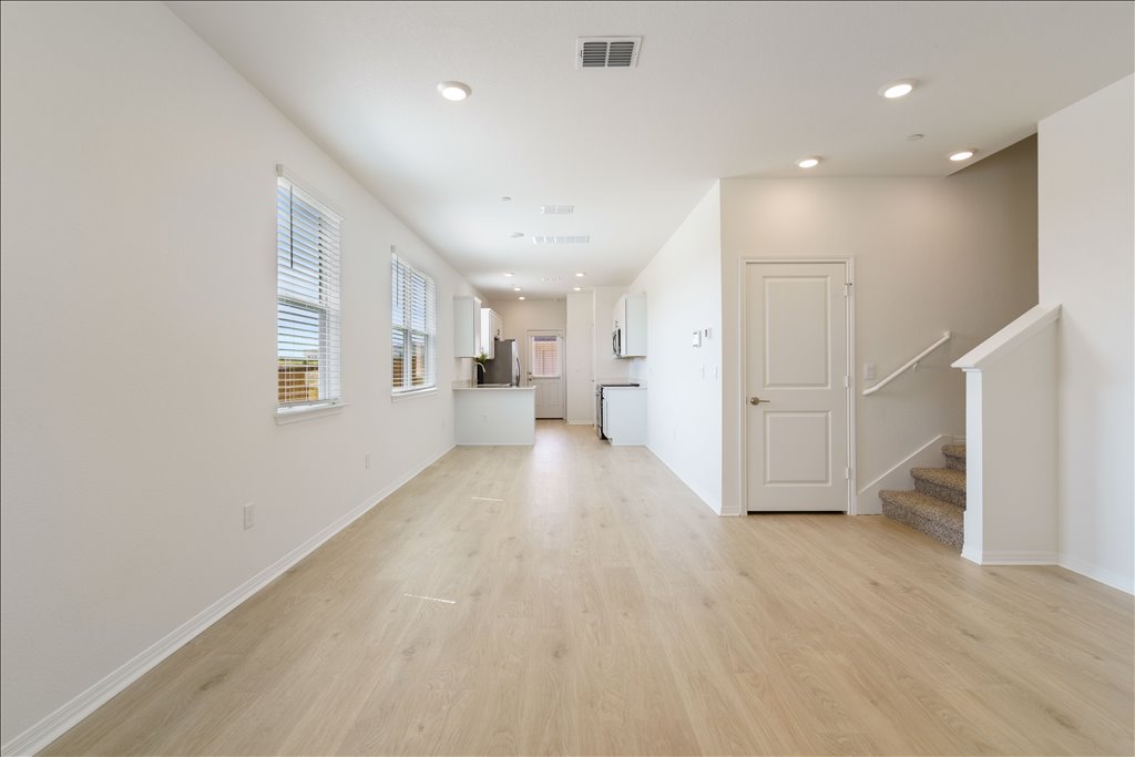 2534 Caleb Asher Loop Round Rock, TX 78665 - Photo 29 of 40 a view of a big room with wooden floor and windows