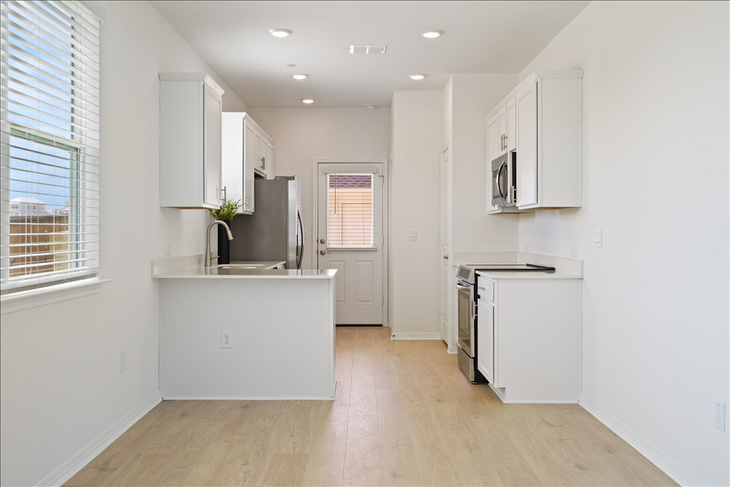 2534 Caleb Asher Loop Round Rock, TX 78665 - Photo 32 of 40 a view of a kitchen with a sink