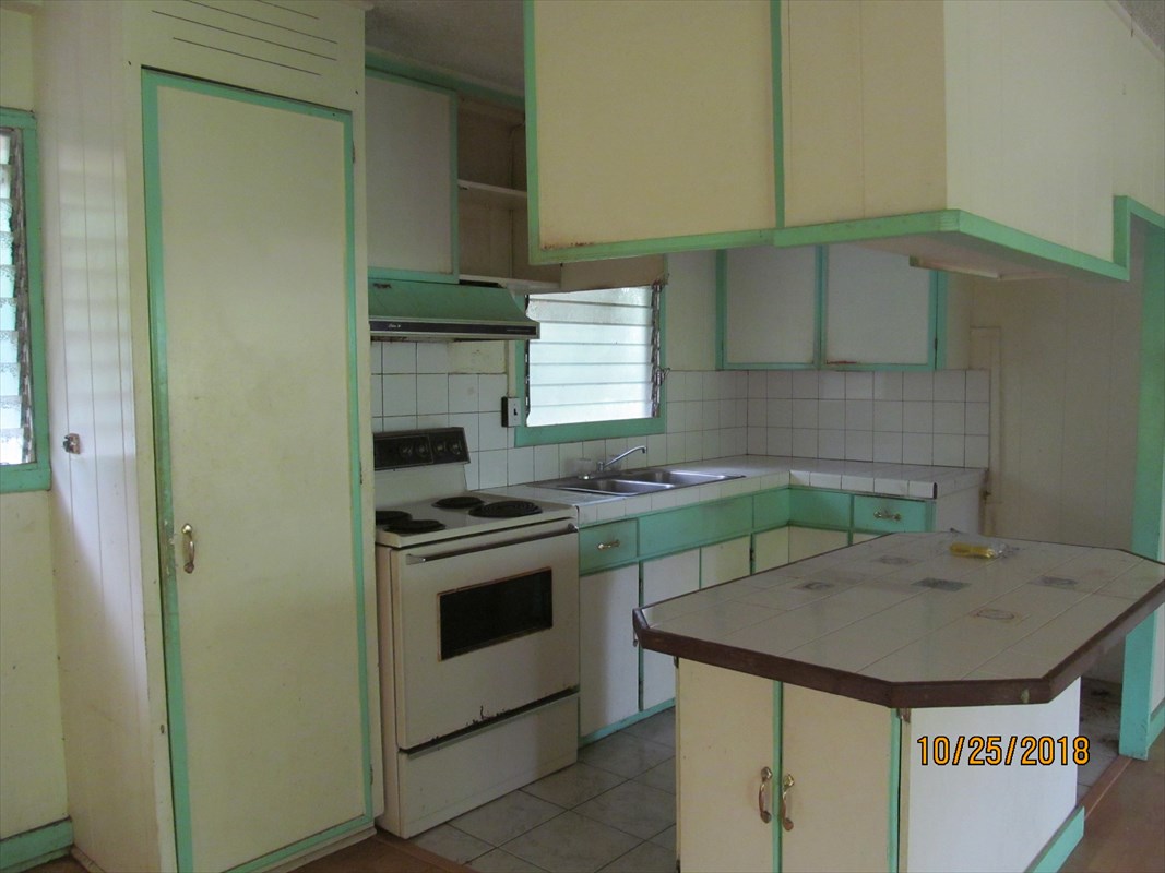 4938 Laipo Road Kapaa, HI 96746 - Photo 5 of 10 a kitchen with a stove and a sink