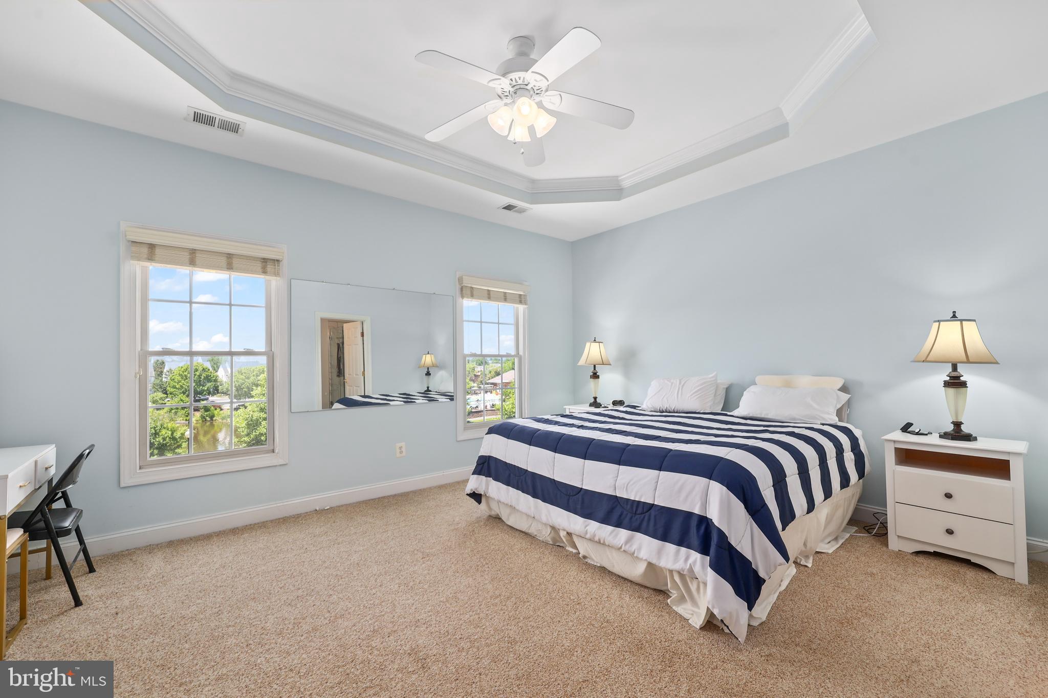 6806 Witton Circle Gainesville, VA 20155 - Photo 16 of 47 a spacious bedroom with a bed and a window
