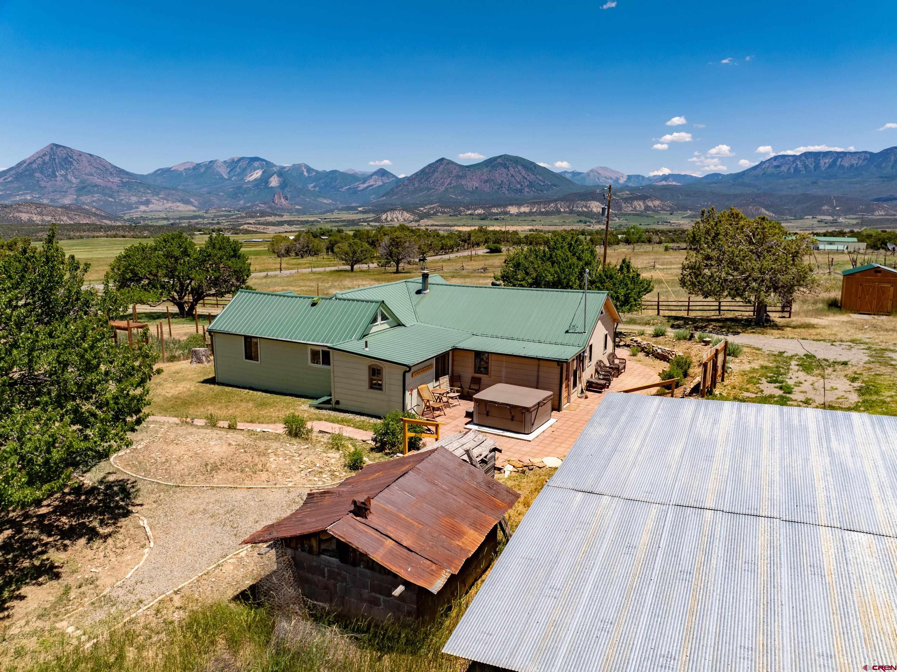 1800 Black Canyon Road Crawford, CO 81415 - Photo 28 of 44 a view of a terrace with a table and chairs