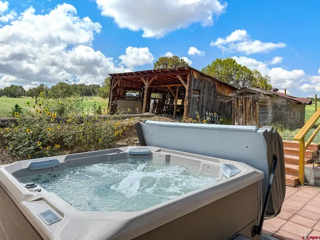a view of house with a swimming pool