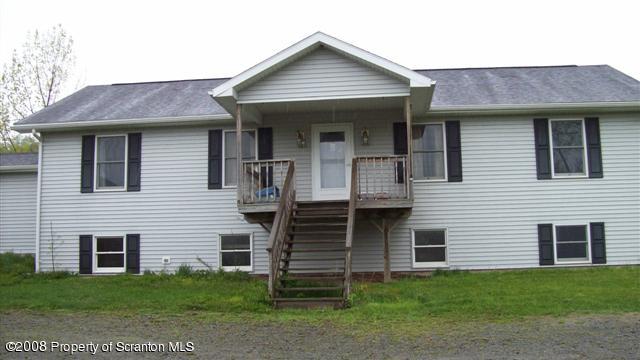 2275 Booth Road Hallstead, PA 18822 - Photo 3 of 10 a front view of a house with garden