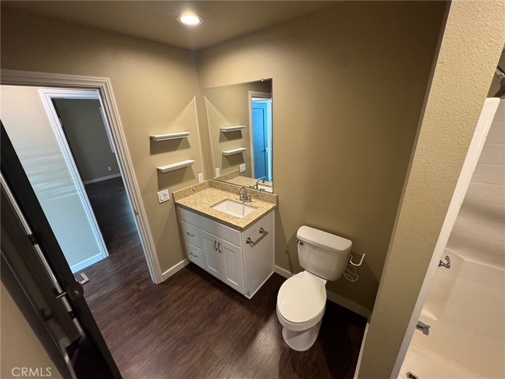 23843 Hayes Avenue, Unit ADU Murrieta, CA 92562 - Photo 12 of 24 a bathroom with a toilet sink and mirror