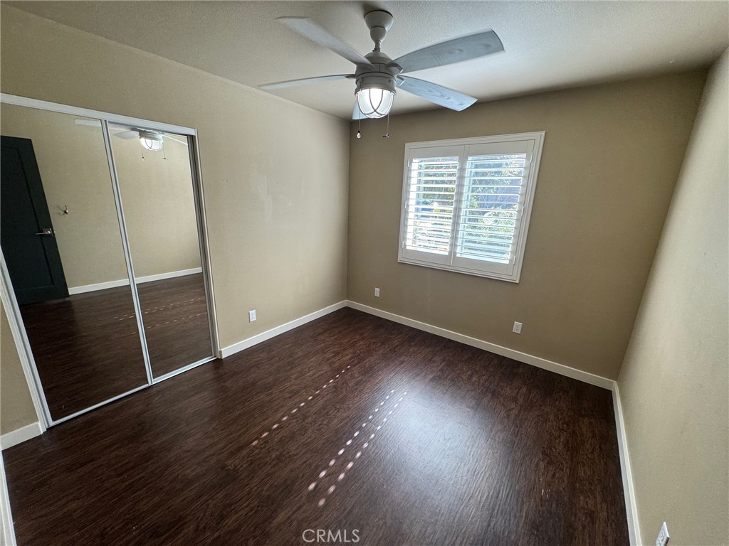23843 Hayes Avenue, Unit ADU Murrieta, CA 92562 - Photo 15 of 24 an empty room with wooden floor and windows