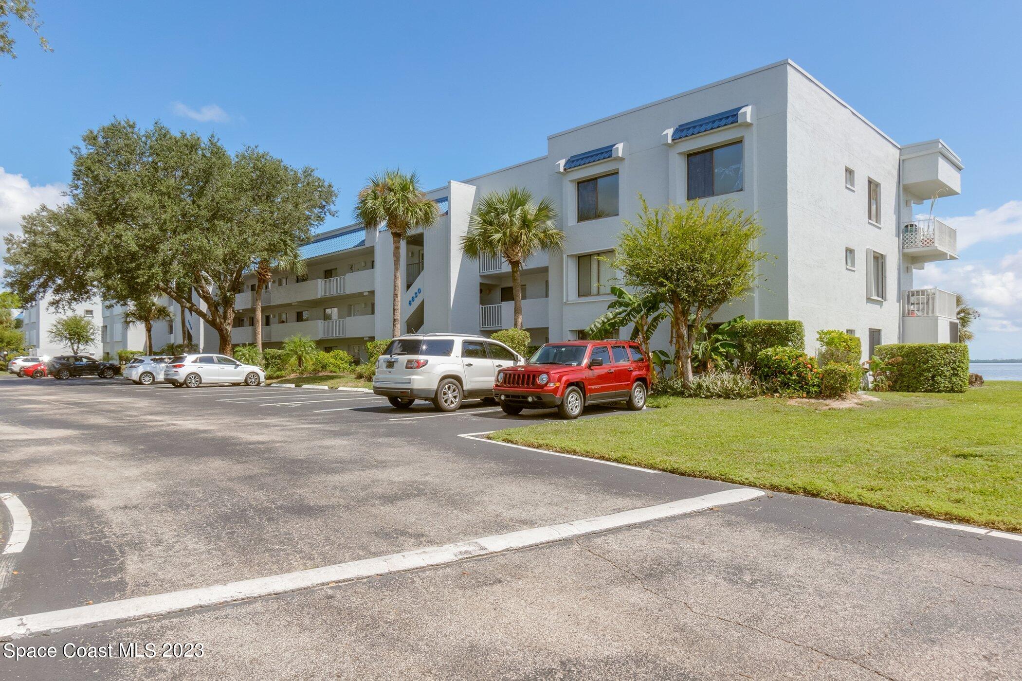 a view of street with parked cars