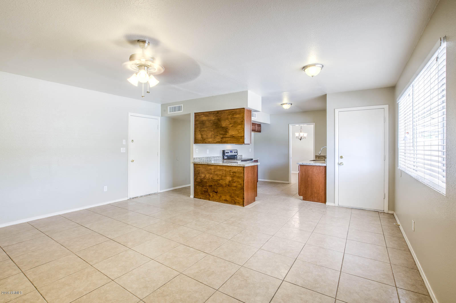 3115 West Cactus Road Phoenix, AZ 85029 - Photo 13 of 30 a view of a room with kitchen view and a window