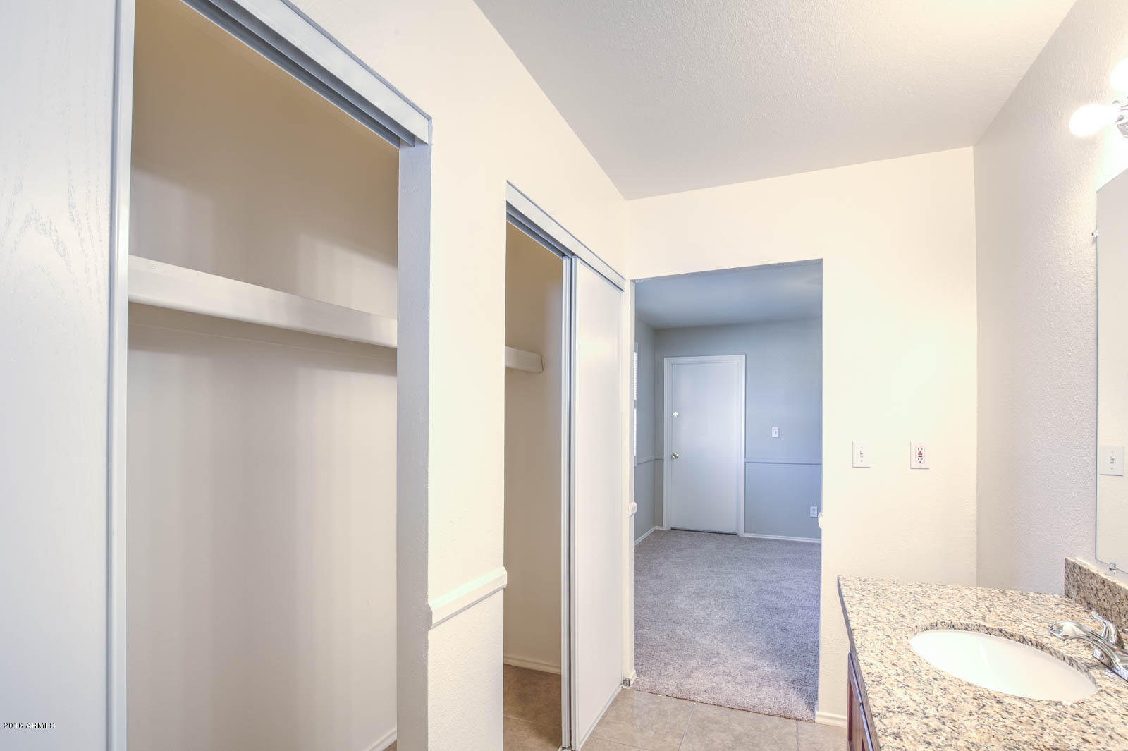 3115 West Cactus Road Phoenix, AZ 85029 - Photo 18 of 30 a view of a bathroom from a hallway