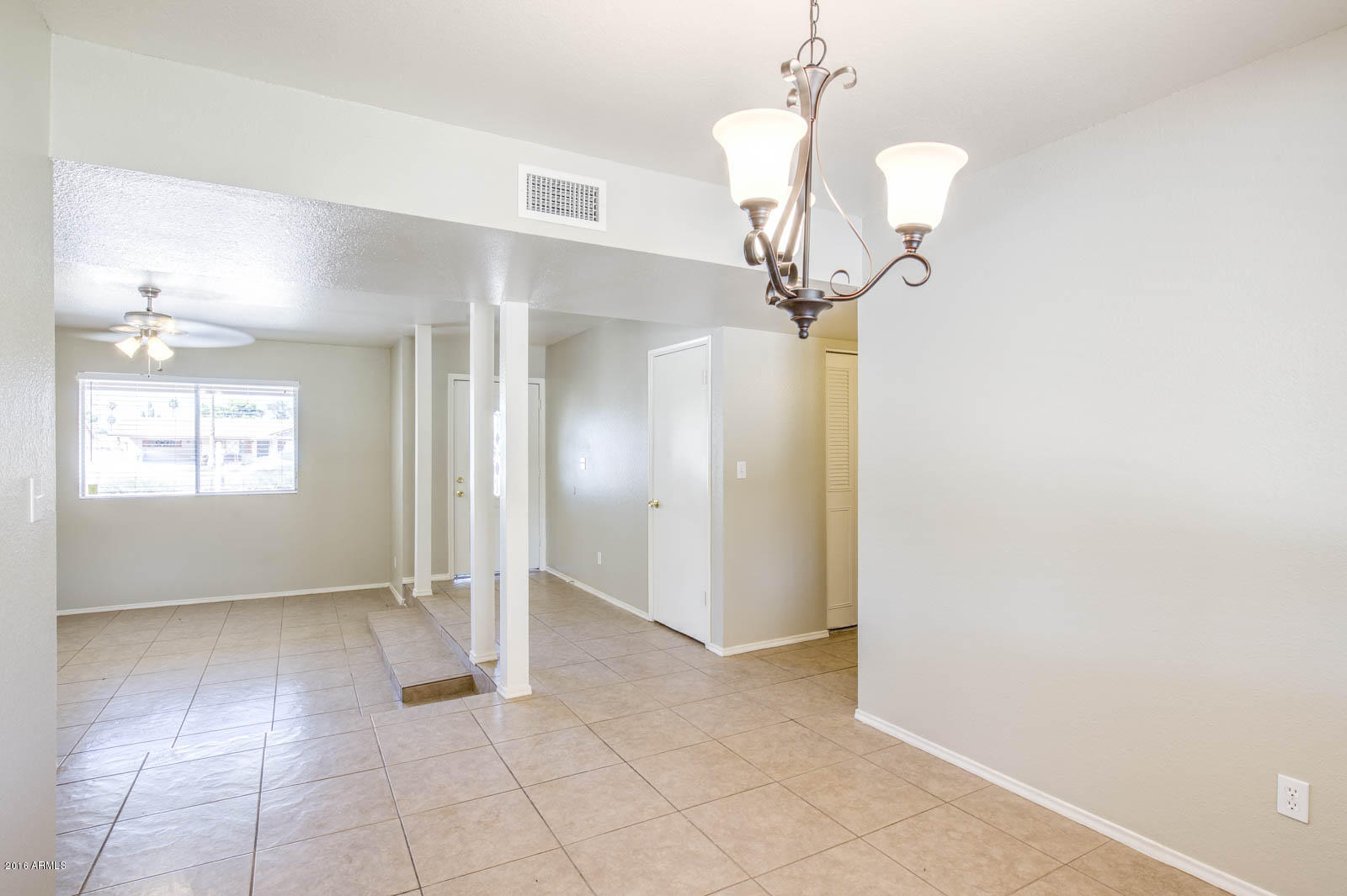 3115 West Cactus Road Phoenix, AZ 85029 - Photo 7 of 30 a view of a chandelier fan and entryway