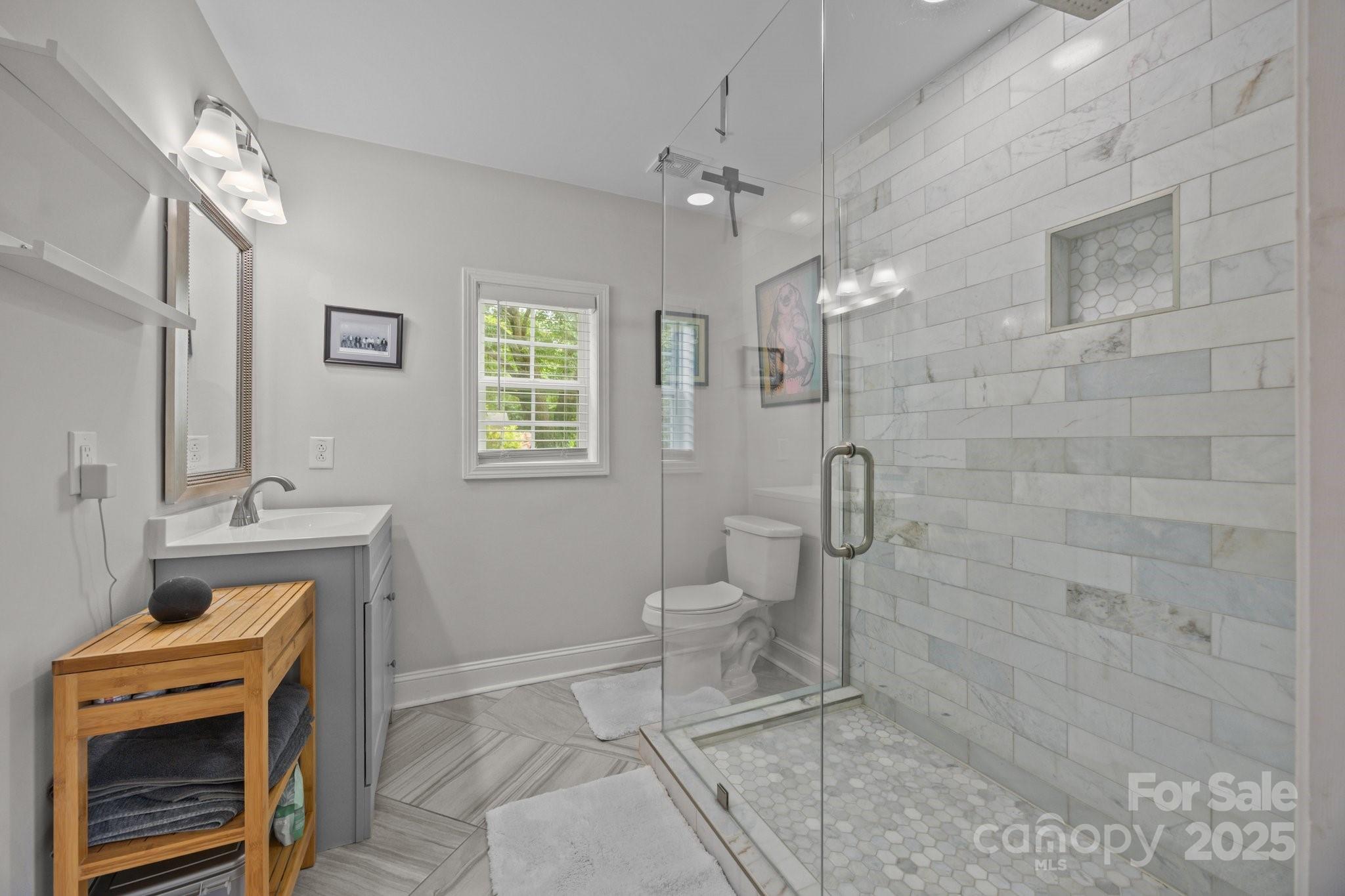 5371 Davidson Road Davidson, NC 28036 - Photo 15 of 27 a bathroom with a sink a toilet and shower