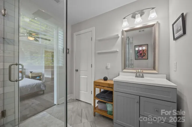 a bathroom with a sink vanity and a mirror