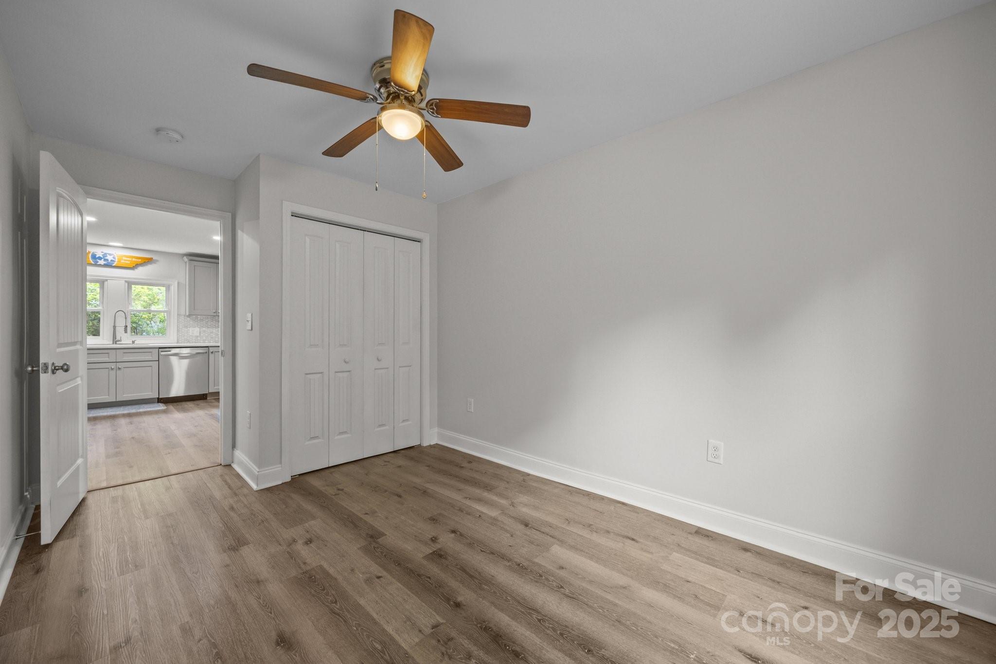 5371 Davidson Road Davidson, NC 28036 - Photo 20 of 27 wooden floor in an empty room with a window