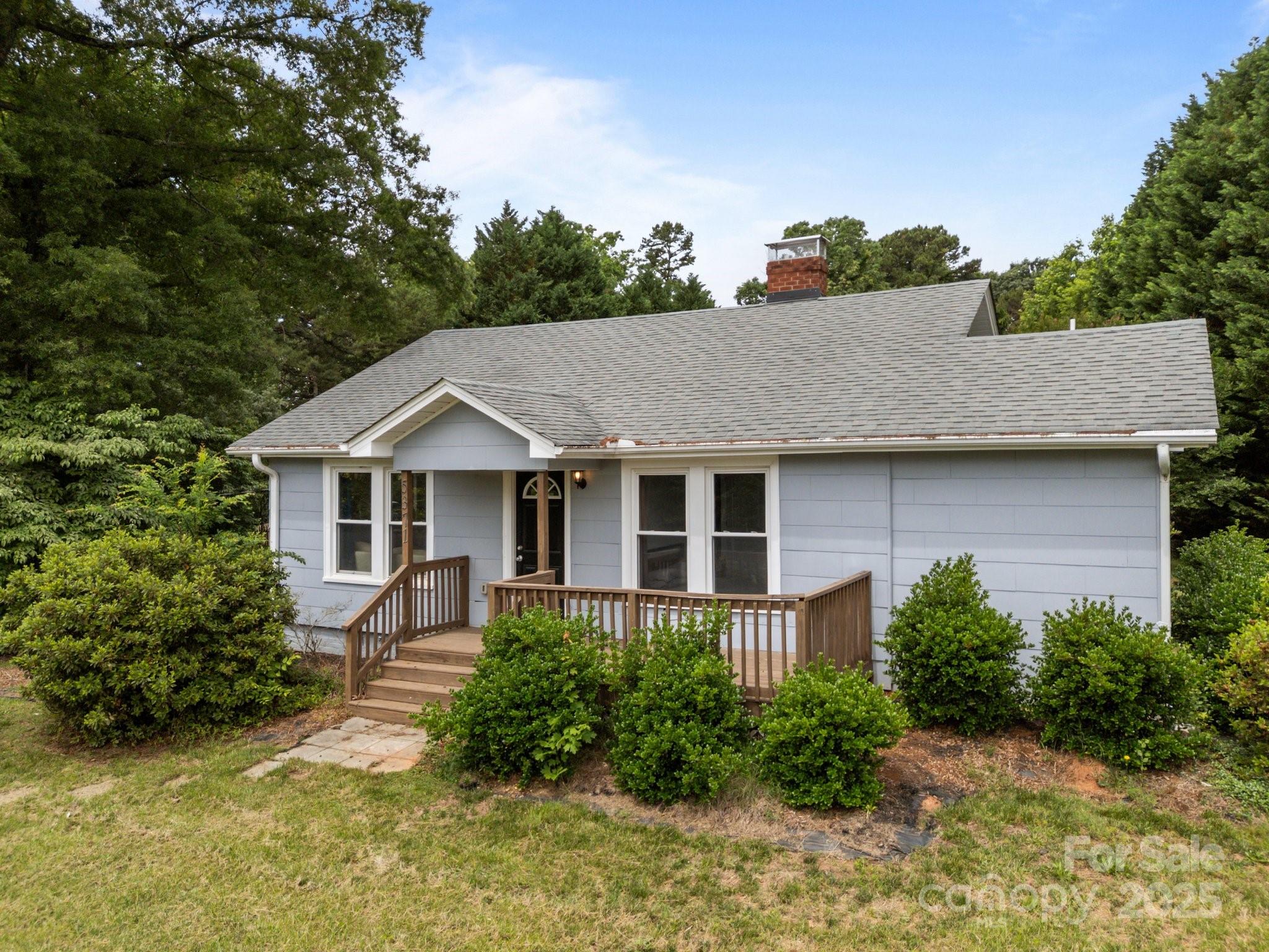 5371 Davidson Road Davidson, NC 28036 - Photo 2 of 27 an aerial view of a house with a yard and potted plants